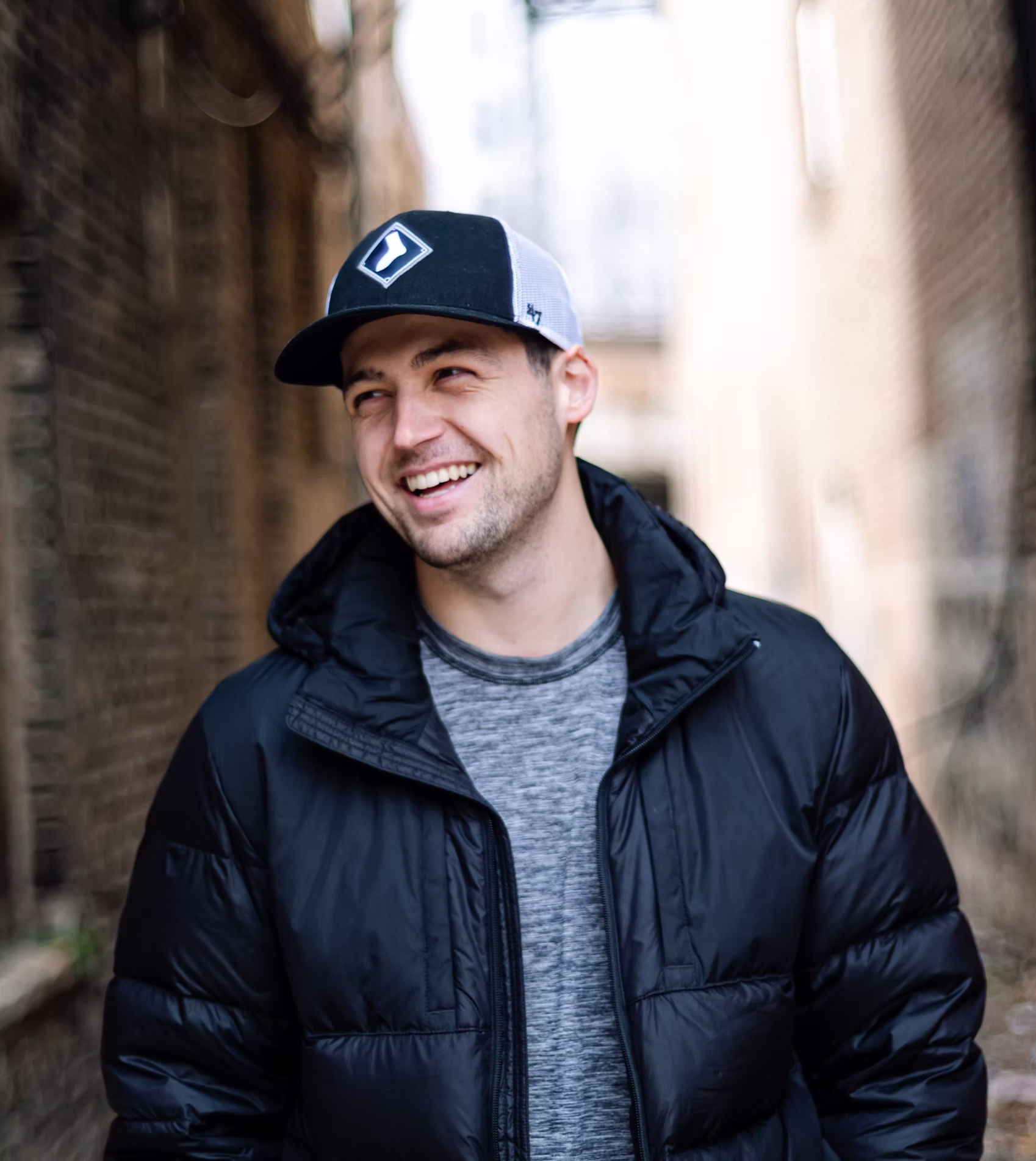 demko smiling outside a warmly lit building